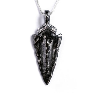 Blackened sterling silver arrowhead pendant on a white background.