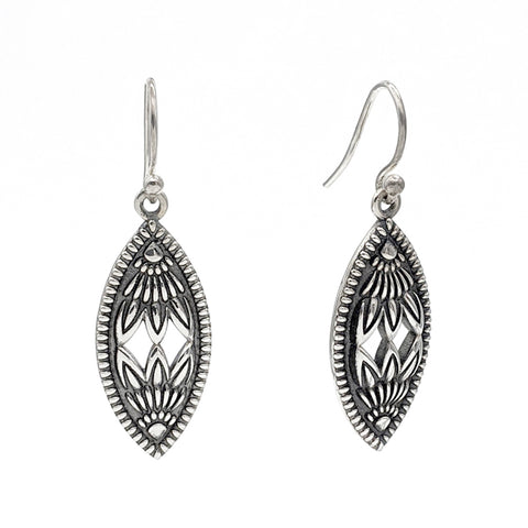 Sterling silver marquise shaped earrings with raised patterns on an oxidized background.